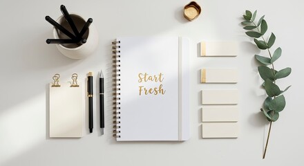 Start Fresh Motivational Quote on a Notebook on a Clean White Desk