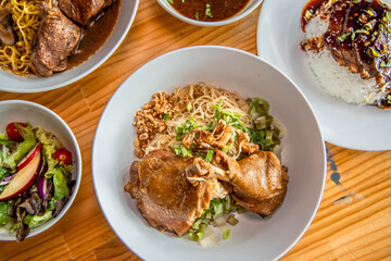 Delectable Cuisine: A top-down shot presents an array of tempting dishes, artfully arranged with an eye for detail, each plate promising a unique culinary adventure.