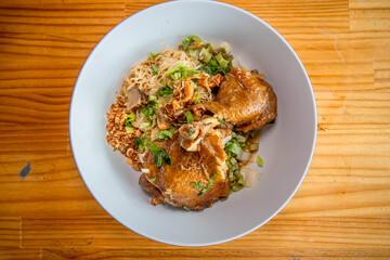 Delicious Chicken Dish in a Bowl: A mouthwatering chicken dish artfully arranged in a bowl, presenting a top-down view, showcasing the culinary creation's appetizing features and textures.