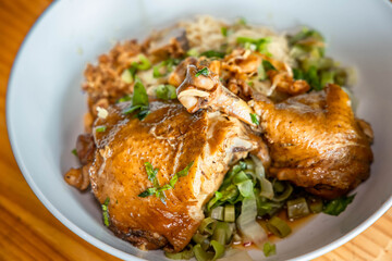 Savory Chicken Dish: A close-up shot showcases a tempting bowl of flavorful chicken dish, with tender chicken pieces and aromatic accompaniments, ready to tantalize the taste buds.