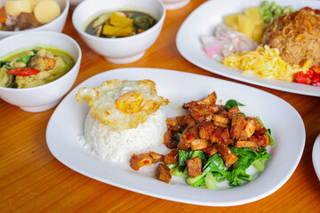 A Culinary Feast of Thai Cuisine: An enticing array of vibrant Thai dishes, beautifully arranged, each plate telling a story of flavor and tradition. A top-down perspective highlighting the details.