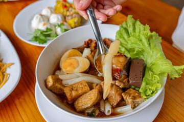 Asian Culinary Delights: A captivating image showcasing a close-up shot of an exquisite Asian dish, rich with savory flavors and inviting textures. A delightful culinary experience.