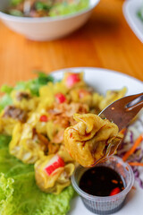 Culinary Delights: A close-up shot of a dumpling being pierced by a fork, showcasing the artistry of flavor. A symphony of taste and texture comes alive.