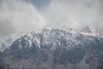 Majestic snow-capped Himalayan hill under a serene winter sky, showcasing natural beauty, mountain landscape, wilderness, and pristine travel destination for nature and adventure lovers