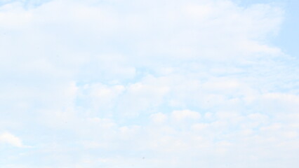 Clear skies, a yellow sun at dawn, on September 18, 2025, with a view of clouds like snow in summer, exotic clouds, and a beautiful sky in the background.