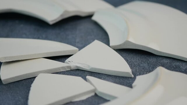 a broken plate on a floor 