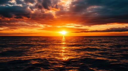 Obraz premium Golden hour spectacle: Dramatic sunset paints ocean canvas with vibrant hues of twilight beauty
