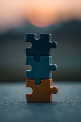 Wooden puzzle blocks stacked together in colorful arrangement at sunset, concept of teamwork, business strategy, abstract creativity, problem solving, connection, and modern minimal design