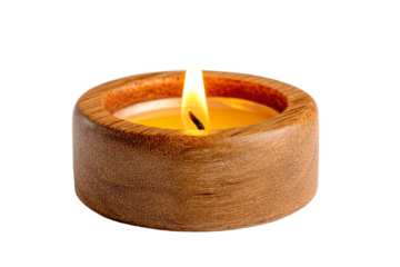 a candle is lit in a wooden bowl