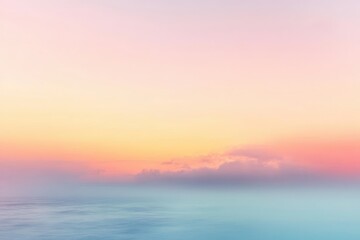 Fototapeta premium Calm ocean under a colorful pastel sky with soft clouds during sunrise or sunset creating a peaceful and serene atmosphere