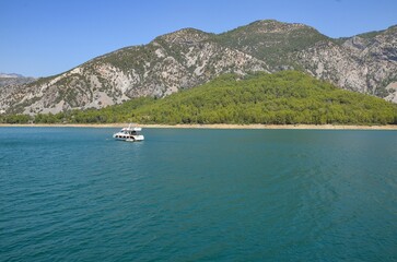 Türkiye, Side, August 22, 2025, tourist attraction green canyon, the white ship is sailing in the green canyon