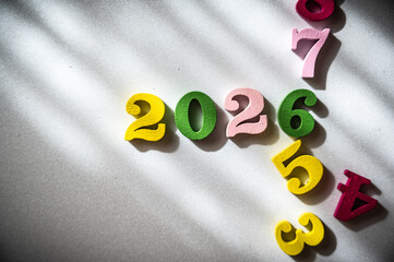 Colorful Numbers Representing Year 2026 with Soft Sunlight Shadows