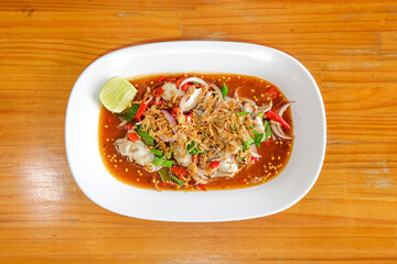 Exquisite Seafood Salad: A culinary masterpiece featuring fresh seafood artistically arranged in a...