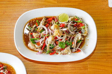 Seafood Appetizer Platter: A close-up shot of a seafood appetizer platter presented on a wooden table, this delicious dish offers a symphony of flavors, perfect for sharing or as a delightful starter.