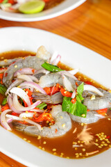 Savory Shrimp Salad: A close-up of a delectable plate of vibrant shrimp salad, bursting with fresh flavors, with ingredients like chillies and onions, showcasing culinary delight.