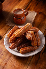 Churros. Fried wheat flour dough, a very popular sweet snack in Spain, Mexico and other countries where it is customary to eat them for breakfast or snack accompanied by hot chocolate or coffee.