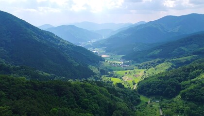 Naklejka premium Lush valley nestled between mountains (1)