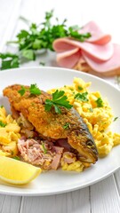 A plated dish of breaded and pan-fried fish, filled with ham and eggs, accompanied by potato noodles and fresh parsley.
