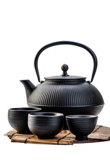 Black Cast Iron Teapot and Cups on Mat