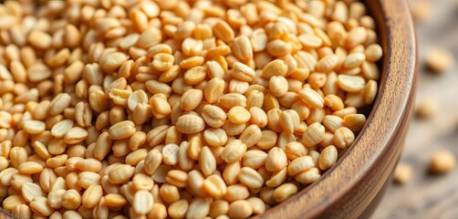 Fototapeta premium Close-up of raw buckwheat groats in a wooden bowl, healthy lifestyle, rustic