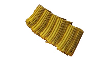 Lapis legit cake with distinct layers on a white background. The cake exhibits a golden-brown hue and a rich texture.