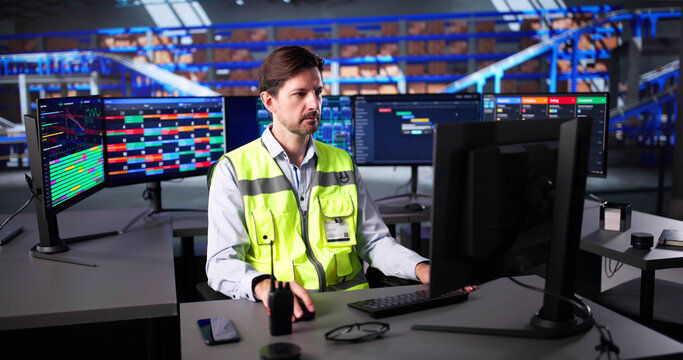 Factory Worker Uses Automated Software To Track Delivery Logistics