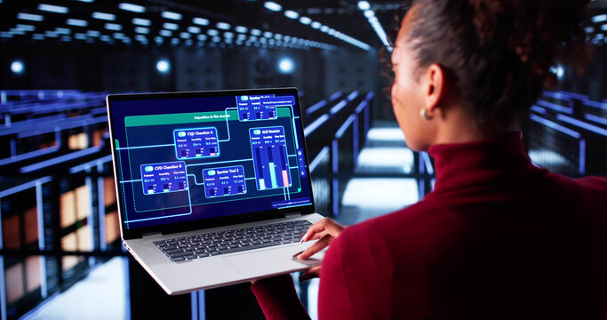 African American Woman Working In Cloud Computer Server Room - Powered by Adobe