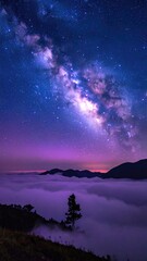Milky Way Galaxy over Misty Mountains and Lone Tree at Night