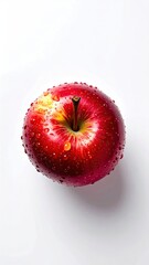 Close-up of a ripe red apple with water droplets on a white background