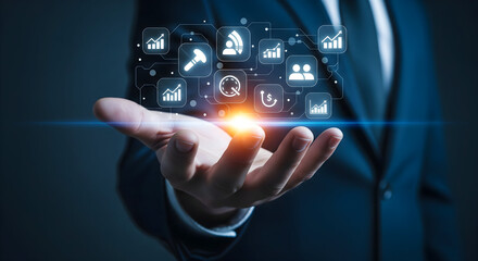 Business icons hover over hand, representing digital transformation and growth