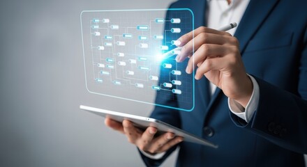Businessman using digital tablet with data flow chart for business process management