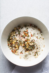 overhead view of savory biscotti ingredients in a bowl, top view of savory cookie ingredients in a mixing bowl