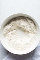 overhead view of savory biscotti ingredients in a bowl, top view of savory cookie ingredients in a mixing bowl