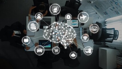 A top-down view of a diverse team collaborating around a table, with a conceptual brain network graphic illustrating data and technology integration in a business setting. Raster - Powered by Adobe