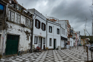 Old historical houses on the seaside street at Horta town Faial island Azores Portugal