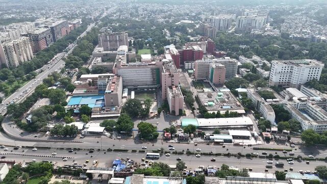 Aerial shot of AIIMS with traffic running on the road in New Delhi, India