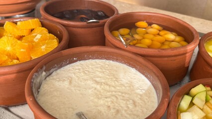 A luxurious hotel breakfast features an extensive selection of baked goods including croissants, bagels, muffins, pastries, breads, cookies, pancakes, waffles, scones, biscuits, donuts, rolls, Danish 