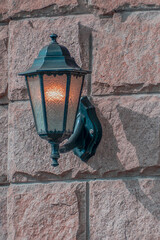 A "burning" street lamp on an autumn day