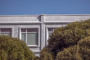 A fragment of the facade of an office building on an autumn day