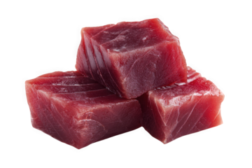 Fresh red fish fillets stacked on a white background.