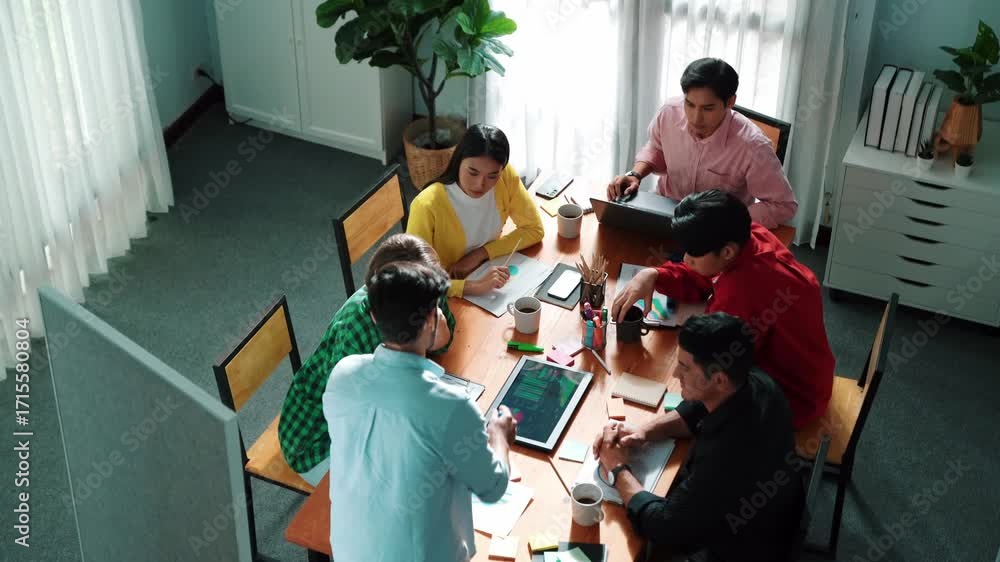 Aufkleber top view of leader present idea at whiteboard while looking and analyzing at financial graph in tabl
