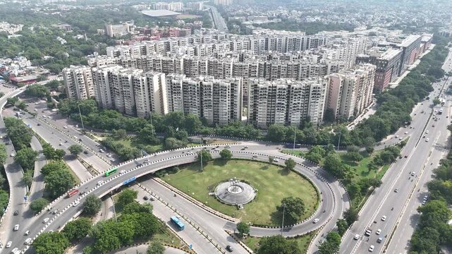 Aerial shot of the residential buildings and flyover with running traffic Near AIIMS New Delhi, India