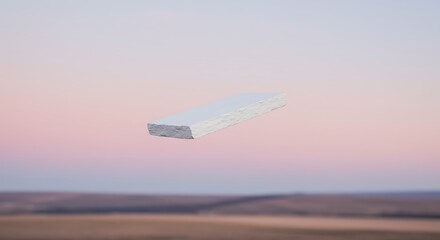 Minimalist White Stone Floating Against Soft Pink and Blue Gradient Sky