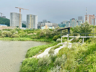 Park area around Lake Torfyanka in Patrokl Bay in Vladivostok in summer during cloudy weather