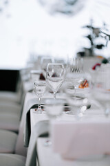 Elegant dining setup showcasing glassware in a fine restaurant during an evening event