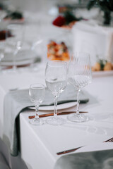 Elegant glassware arranged on a table setting in a formal dining event