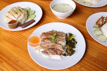 Culinary Delights on Display: A captivating overhead shot showcases an array of appetizing dishes set on a rustic wooden table, featuring cooked food and the culinary arts.