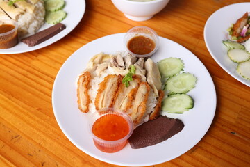 Exquisite Culinary Creation: A delectable dish showcasing an artful arrangement of savory chicken, flavorful rice, and fresh, vibrant cucumber slices