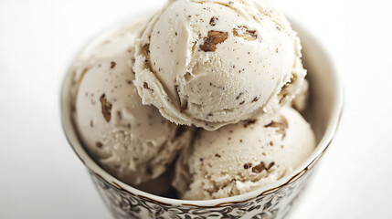 Almond milk ice cream with subtle vanilla specks in a decorative ceramic bowl, shallow depth of field and white background for clean commercial style,