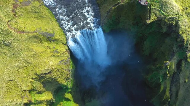 Slow motion aerial view of Skogafoss waterfall, Iceland